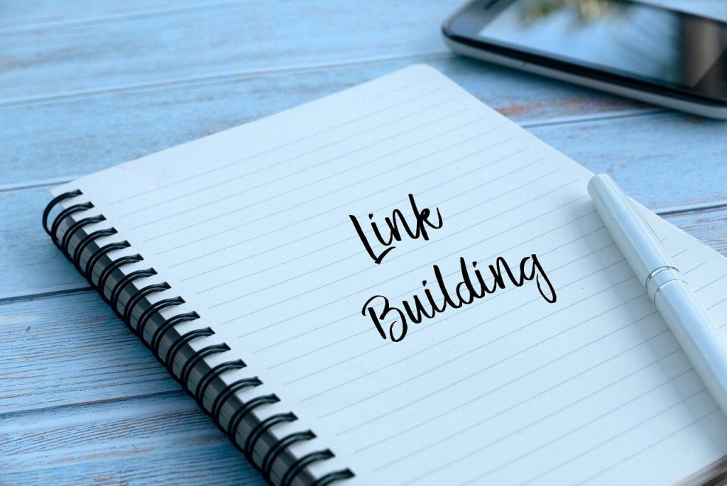link building written on notebook in pen